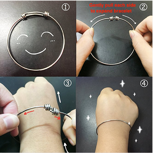 Hands attaching charms to figure skating bangle bracelet during assembly"